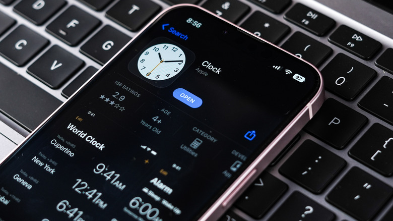 The Clock app open on an iPhone resting on a keyboard