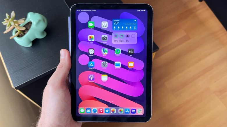 Man holding an iPad mini