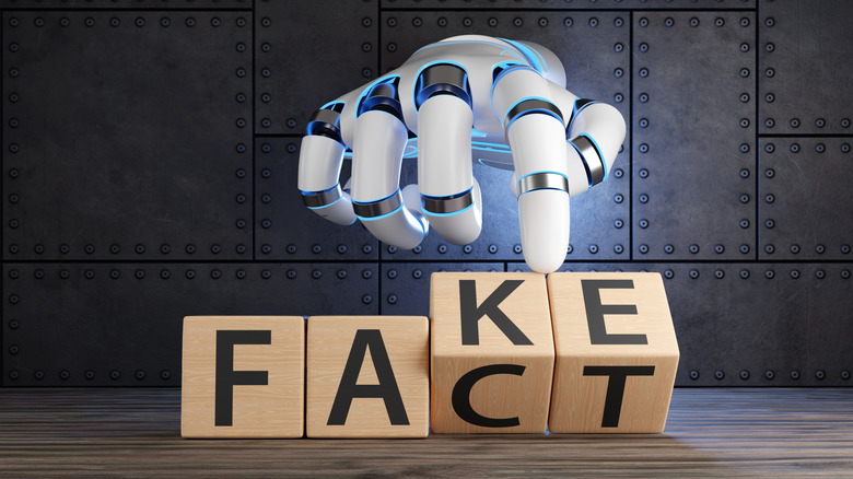 A robot hand reaches through a metal background to change a group of block letters from "FAKE" to "FACT"