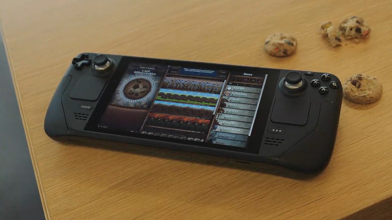 Steam Deck on a wooden table with cookies