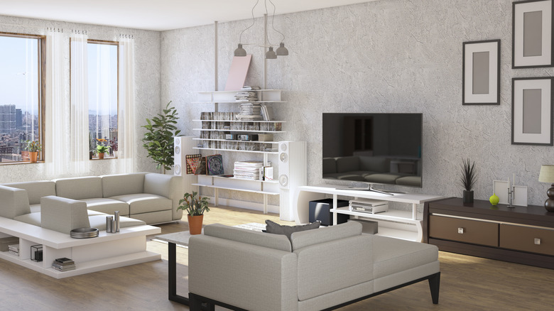 A living room with white colors and modern design.