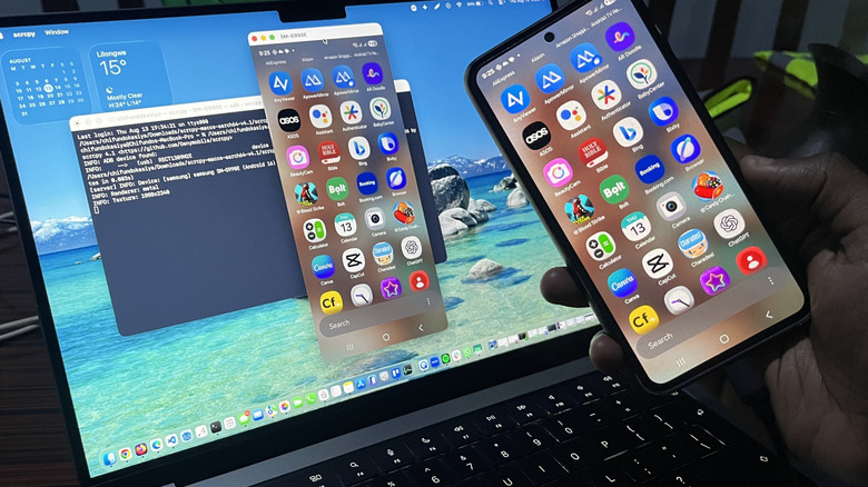 A picture of an Android phone being mirrored on a MacBook