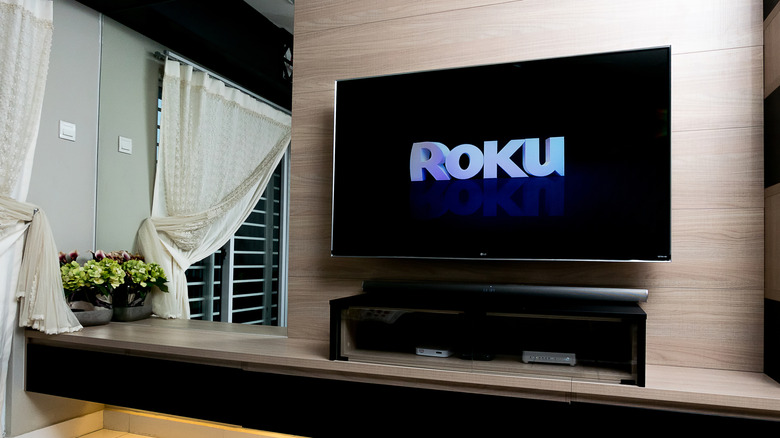 Roku logo on mounted TV in the living room
