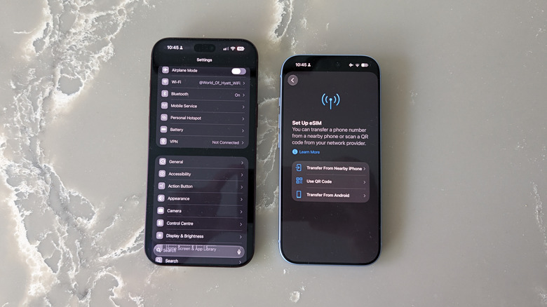 Two iPhones on marble surface with Settings and SIM settings open