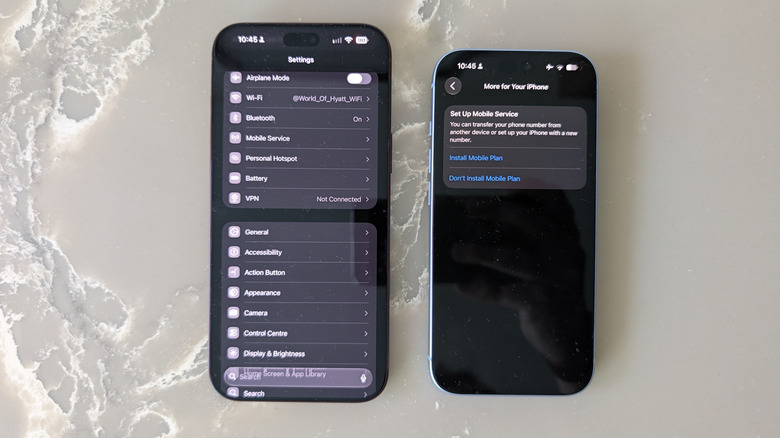 Two iPhones on marble surface with Settings app open