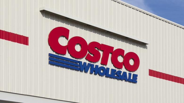The Costco Wholesale logo on the side of a building