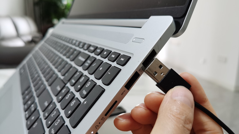 Connecting a USB Type-A cable into a USB port.