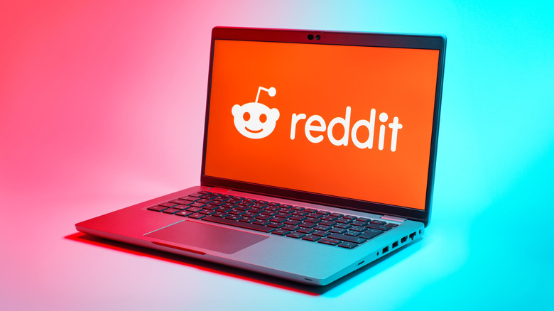 The Reddit logo on a laptop screen