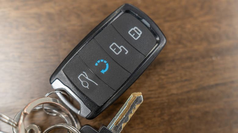 A set of car keys with a keyless entry fob looped in.