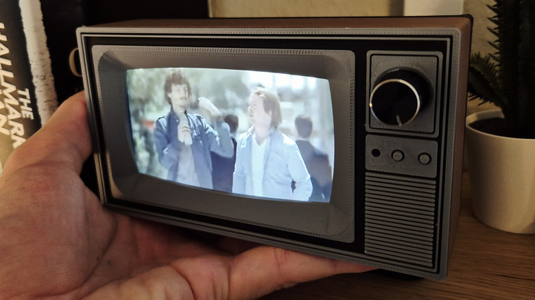small TV being held