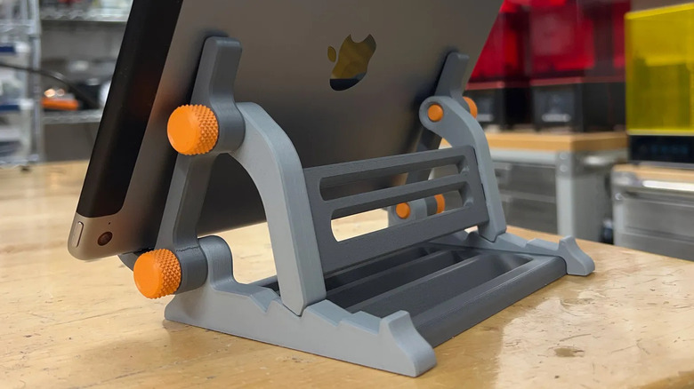 An iPad held up by a 3D printed stand.