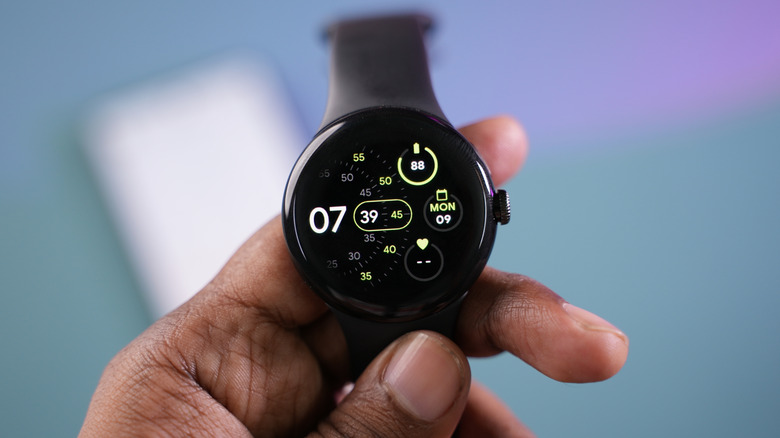 A person holding a Pixel Watch