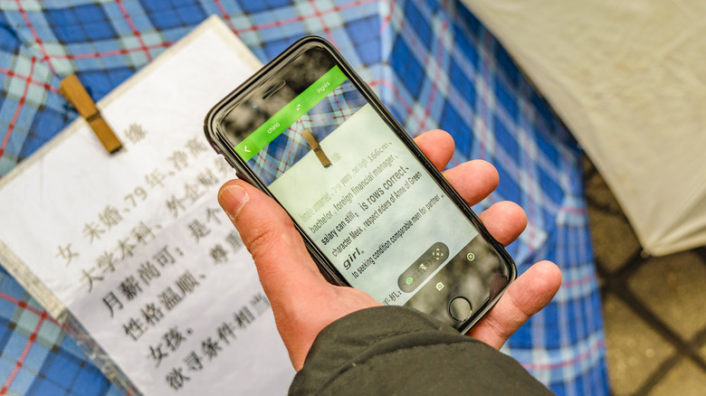 person using google translate on iphone