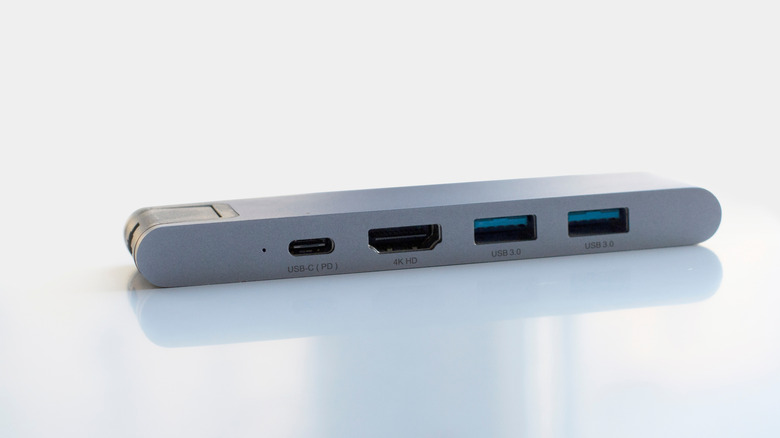 A USB-C hub with USB and HDMI connections.