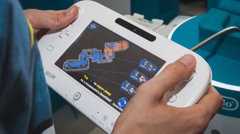 A person using a wii u gamepad