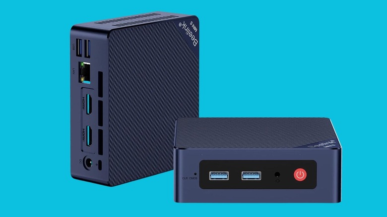 Two Beelink mini PCs on a blue background.