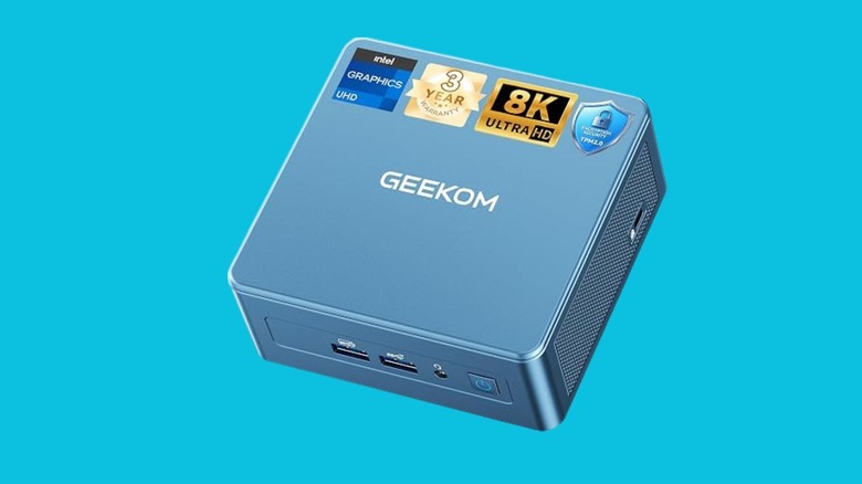 A Blue GEEKOM mini PC with front USB ports, a power button, and Intel graphics and 8K Ultra HD labels.