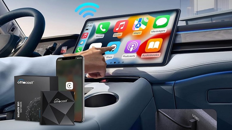 Person using Apple CarPlay with infotainment touchscreen with Ottocast and iPhone on center console