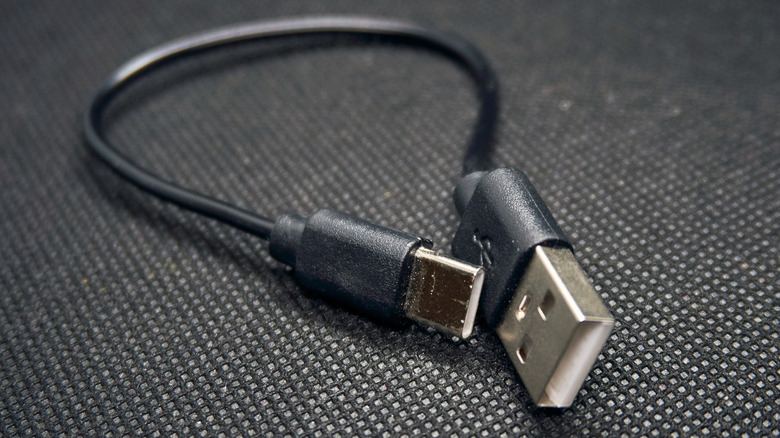 A USB Type-A to USB-C cable on a textured surface