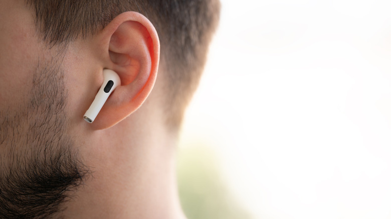 A man with an AirPod in his ear