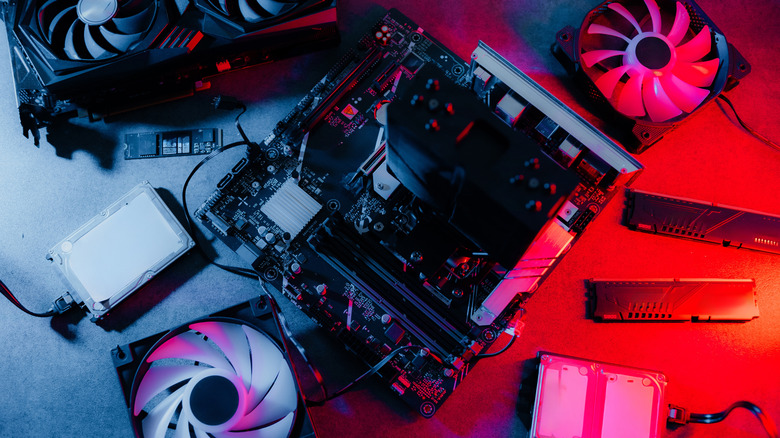 A PC motherboard with assorted components surrounding it