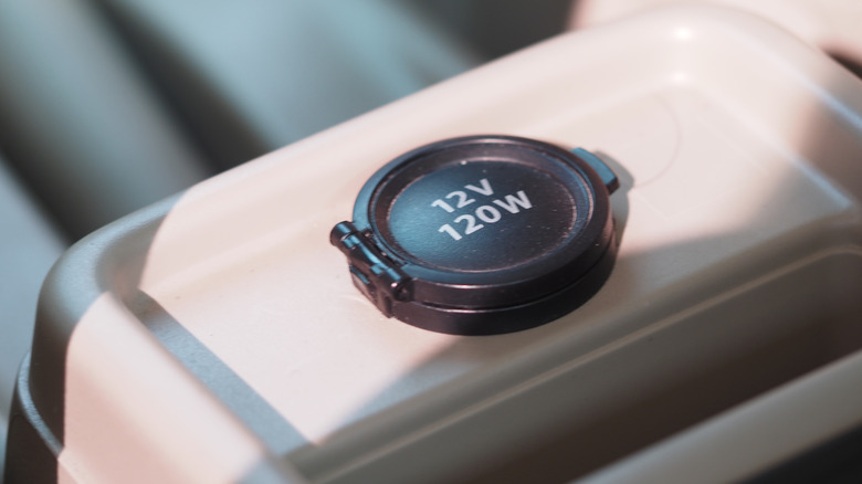 Closeup of a 12v outlet in a car