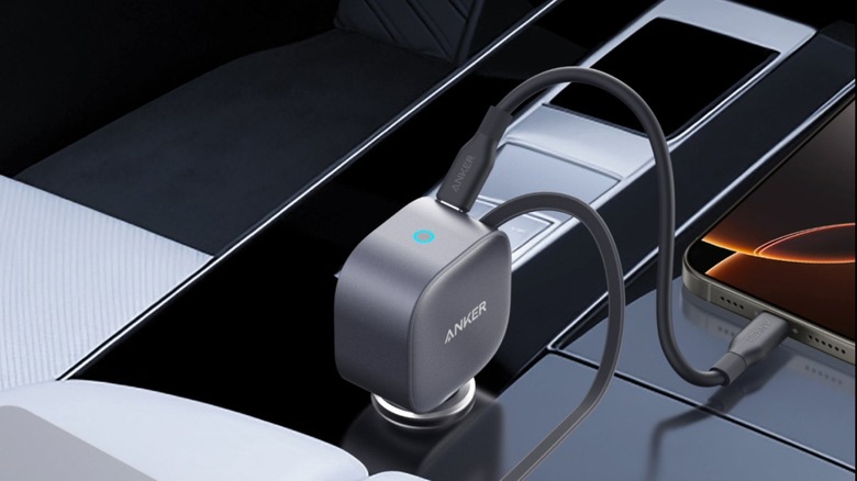 Anker Nano 75W car charger plugged into a 12v socket and charging a phone