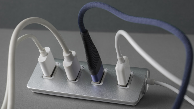 Various cables plugged into a USB hub