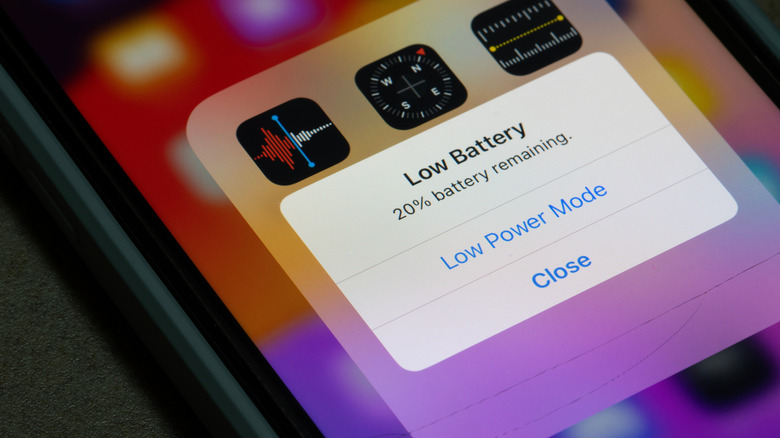 An iPhone screen showing a low battery indicator and the option to switch to Low Power Mode.