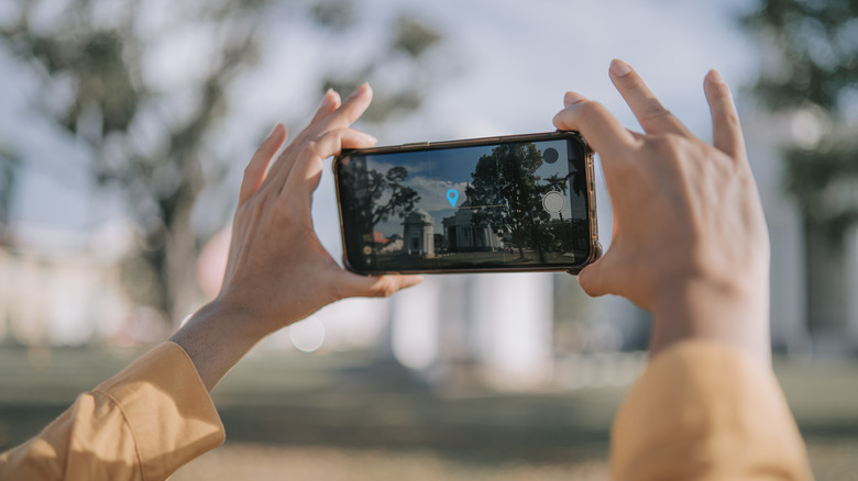 Person taking a video.