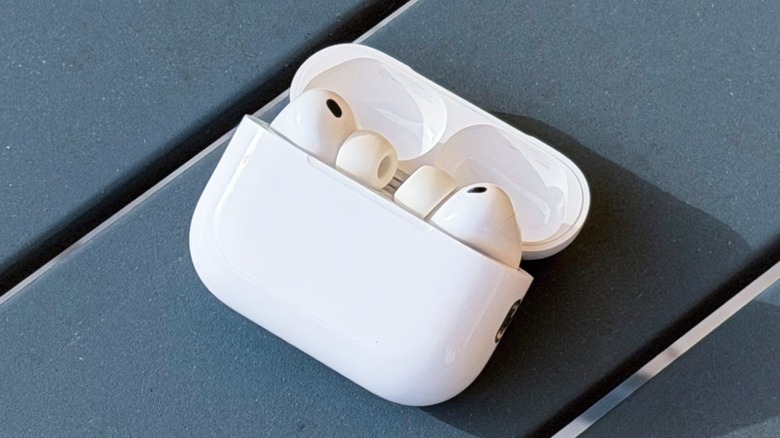 AirPods Pro 3 earbuds inside their charging case on a table