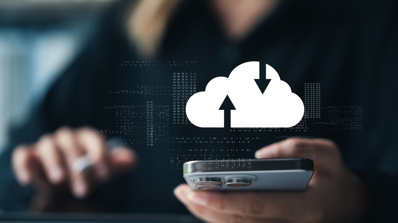 Concept image of a person using smartphone backup service
