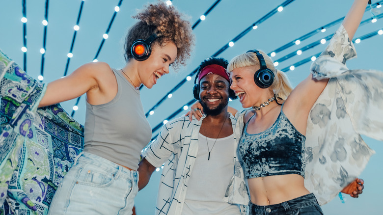People dancing while listening on headphones together