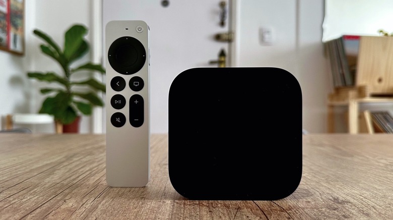 Close-up shot of an Apple TV on a wooden table