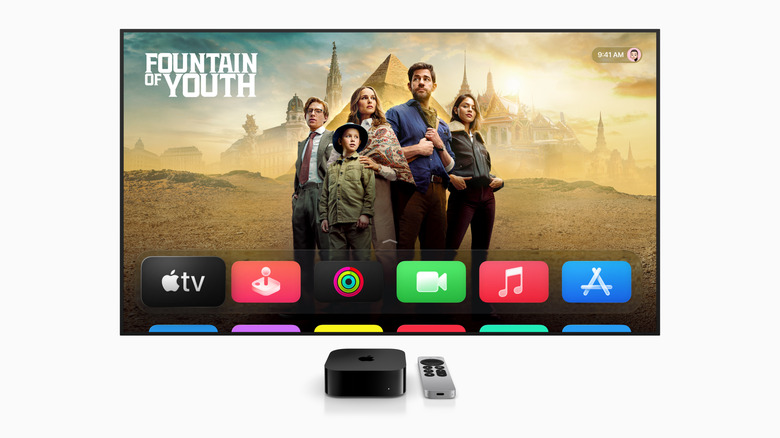 Apple TV streaming on a TV in front of an Apple TV box