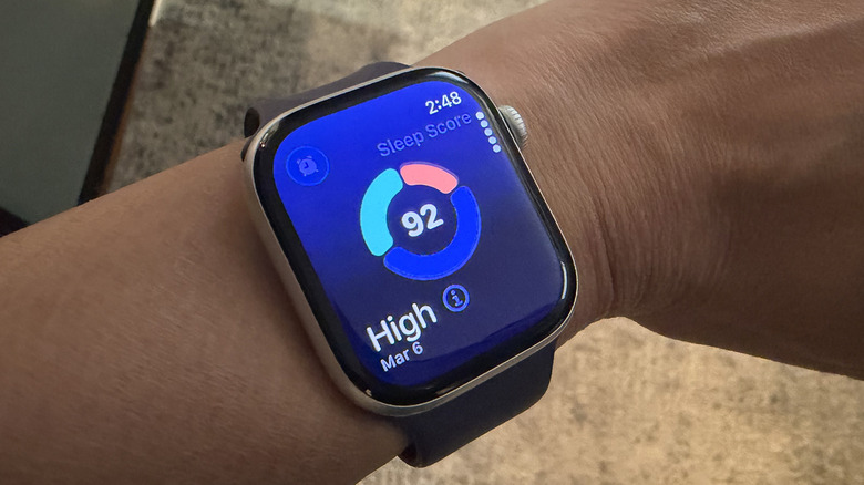An Apple Watch on a wrist showing a Sleep Score.