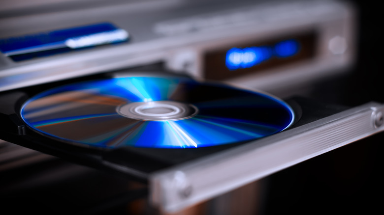 Disc being inserted into a Blu-ray player