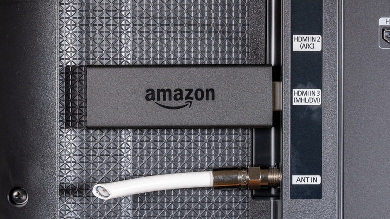 Amazon Fire TV Stick plugged into a TV
