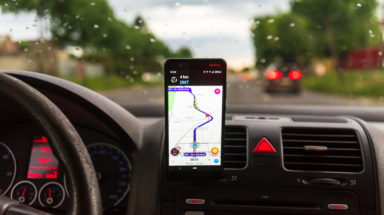 smartphone in a car running Waze