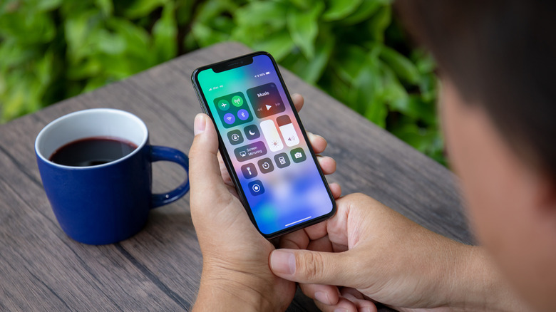 Looking over the shoulder at an iPhone with Control Center open