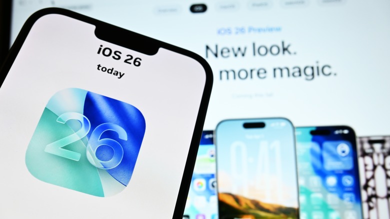 Close-up of an iPhone with iOS 26 on the screen
