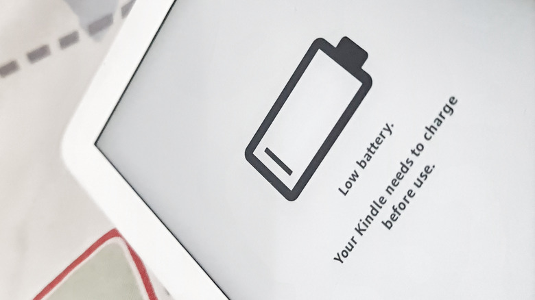 A low battery icon on the screen of a Kindle e-reader.