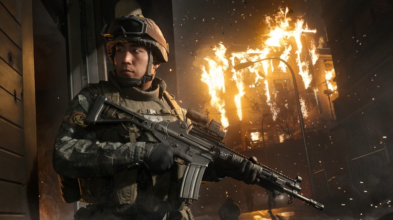Soldier with buildings on fire in the background in Call of Duty Modern Warfare 4