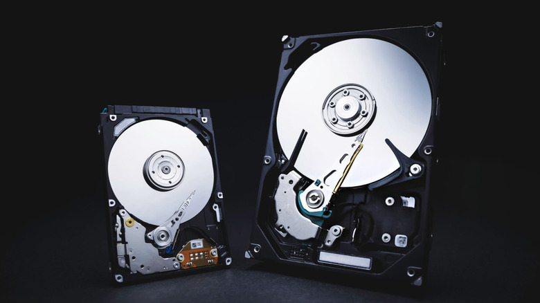 two hard disk drives placed against a dark background
