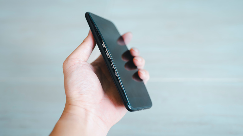 A smartphone showing a bulge caused by built-up battery gases.