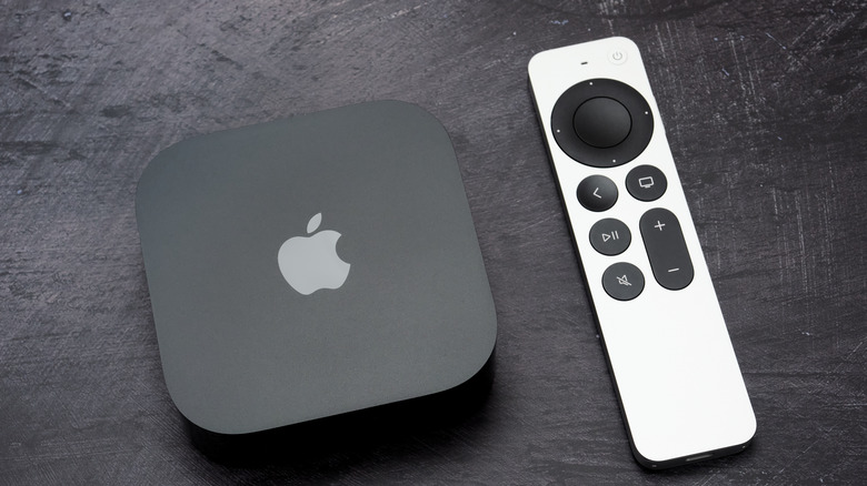 apple tv device next to remote control