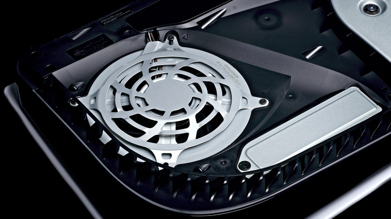 Exposed PlayStation 5 fan laid flat on a surface is pictured.
