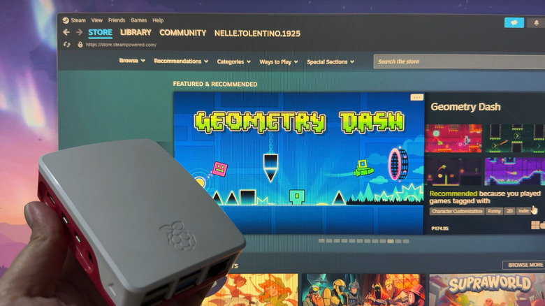 Raspberry Pi in a case with Steam app in the background.