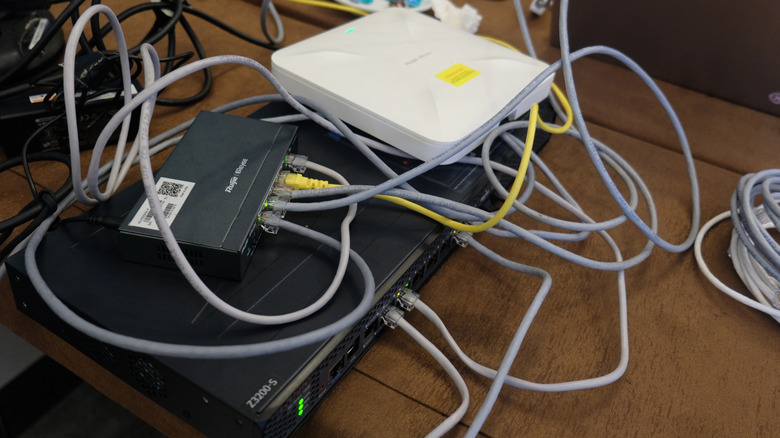 Many network devices stacked atop each other creates signal interference