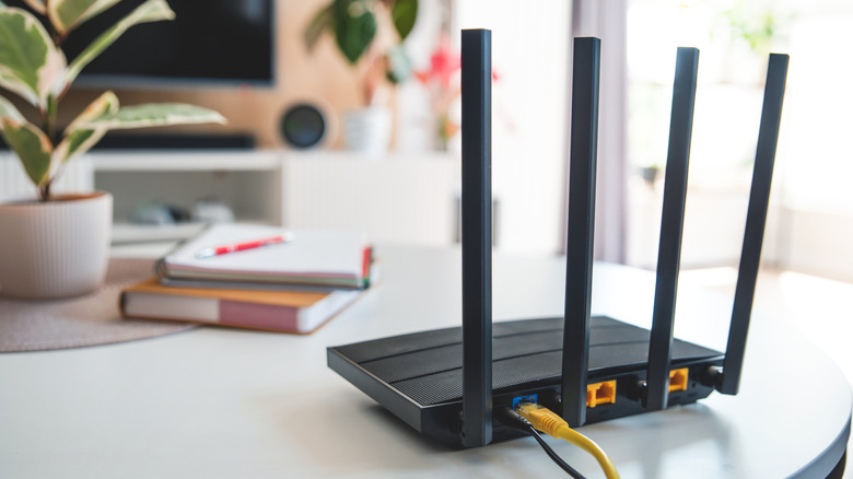 A router sits in an ideal spot atop a table in an open room